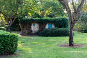 Israeli bomb shelter hidden by the green leaves of plants